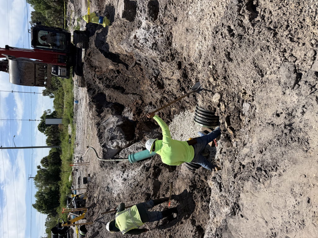 Residential excavator cutting for foundation and trench work