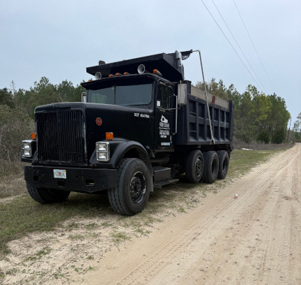Dump truck ready to haul demolition debris from a job site