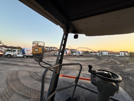 Heavy equipment preparing a commercial construction site