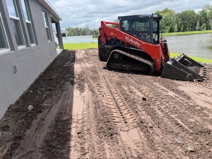 Grading equipment shaping subgrade for the next phase of work